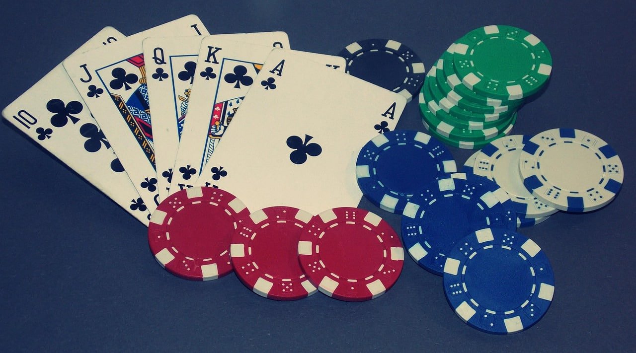 Dealer shaking dice in transparent container